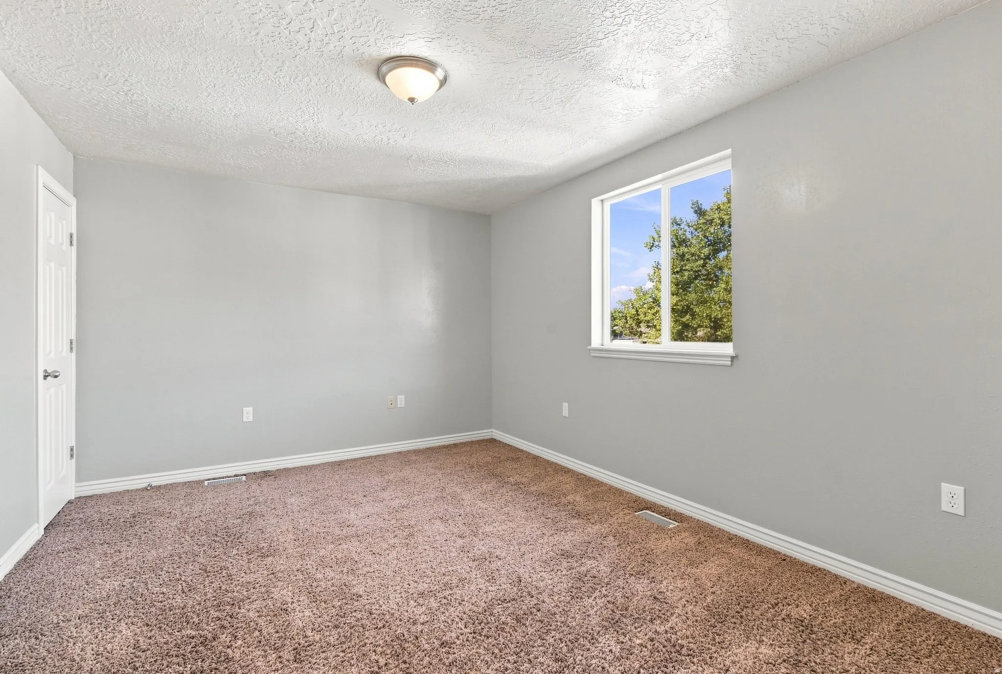 This is one of two basement apartment bedrooms. This bedroom features two large closet's.