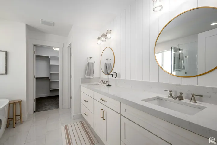 Dual vanity with light-colored countertops and undermount sinks