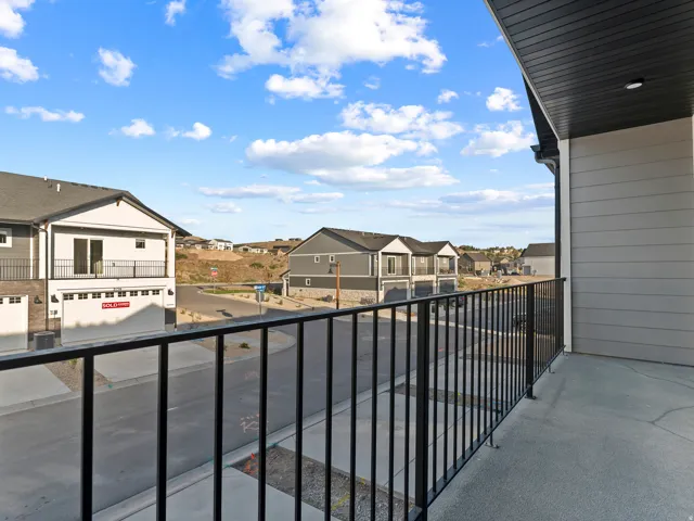 Balcony with black metal railing