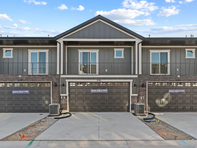 Vertical siding and stone veneer exterior