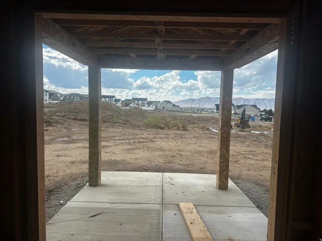 Concrete patio with overhead structural framing