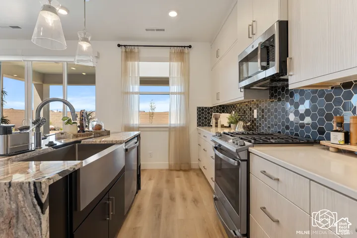 PHOTOS ARE OF A PREVIOUS MODEL HOME featuring the same floor plan and are provided for illustrative purposes only. Colors, finishes, fixtures, and selections may vary. Home will be delivered unfurnished