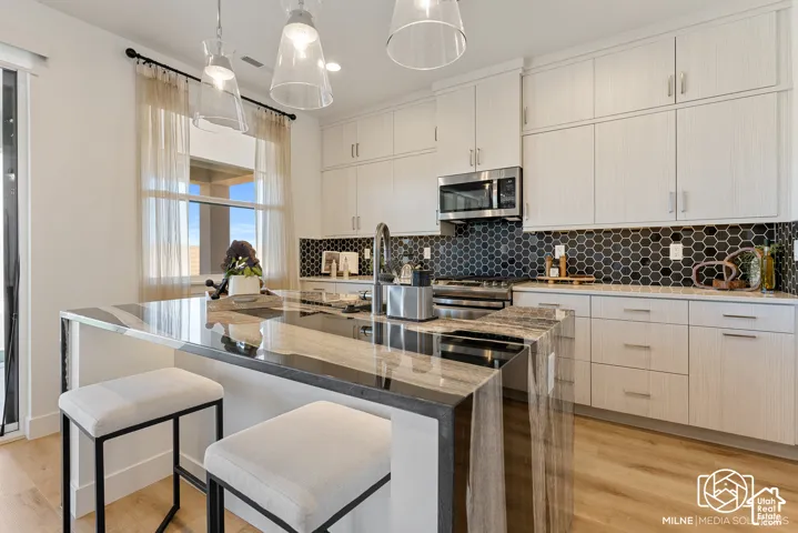 PHOTOS ARE OF A PREVIOUS MODEL HOME featuring the same floor plan and are provided for illustrative purposes only. Colors, finishes, fixtures, and selections may vary. Home will be delivered unfurnished