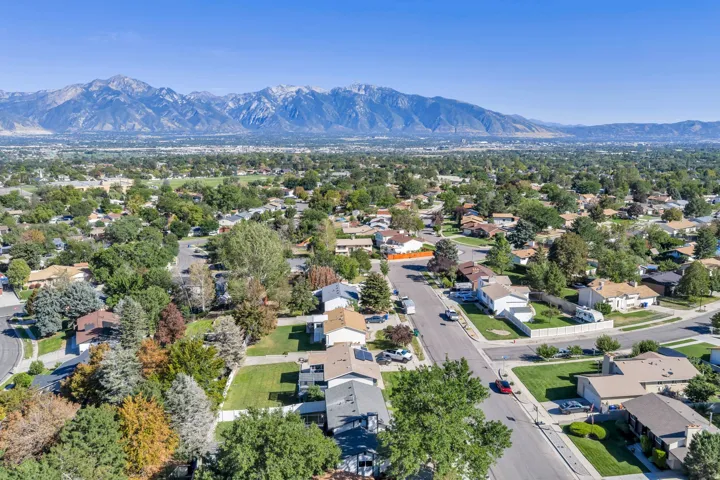 Mountain range backdrop with extensive neighborhood landscaping