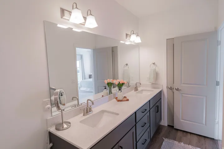 Dual vanity with under-mount sinks and brushed nickel faucets