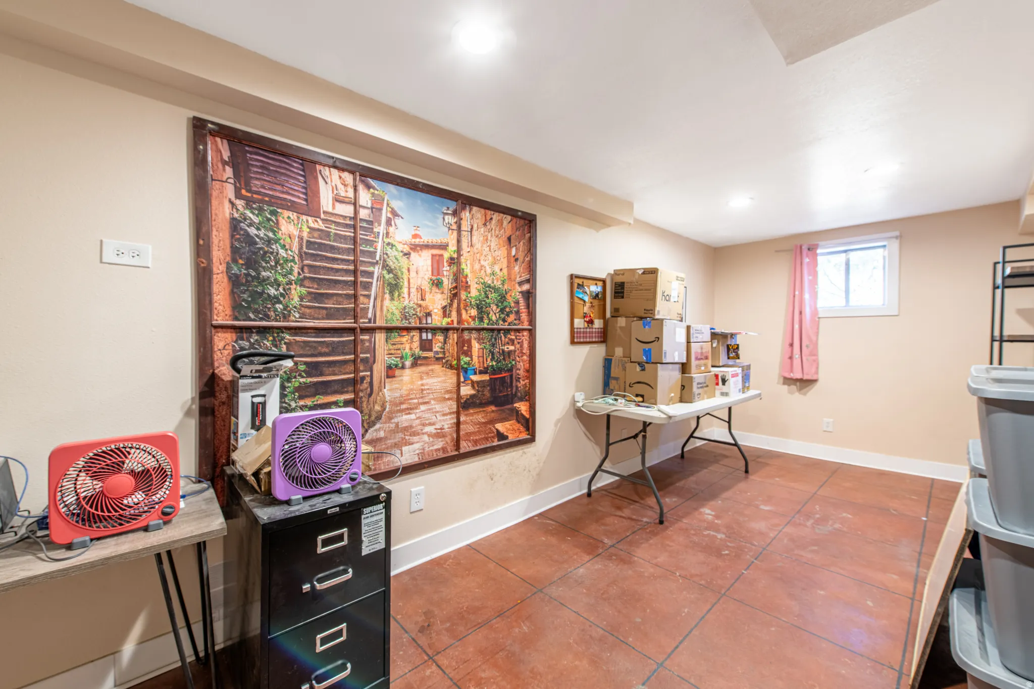 Recessed lighting illuminates the space, featuring a window with a white frame
