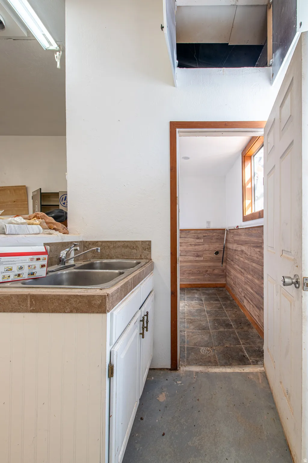 Dual-basin stainless steel sink with tile countertop