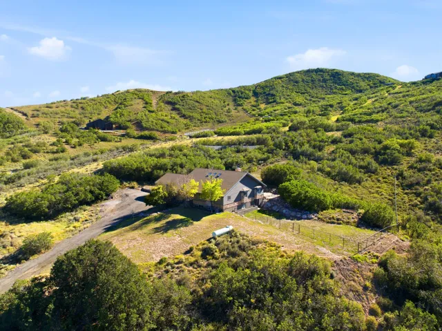 Expansive property set amidst rolling hills with natural landscaping