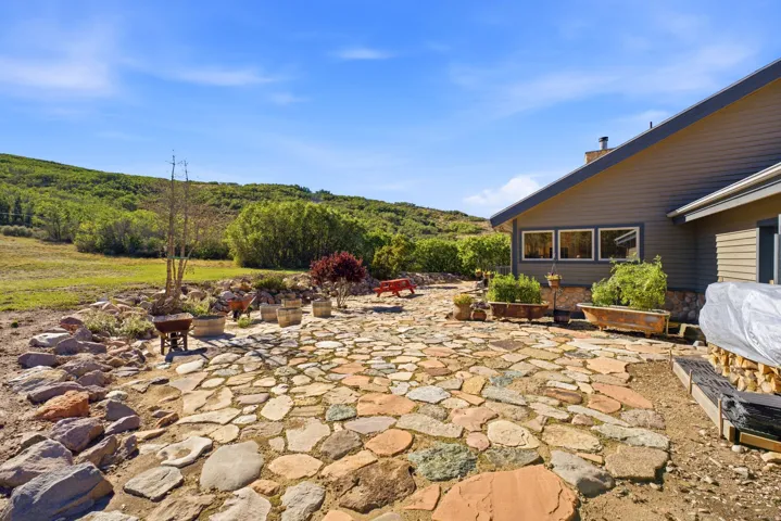 Expansive stone patio with varied-sized pavers