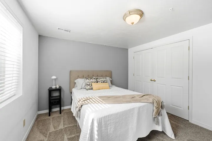 Neutral-toned carpeting paired with light gray wall paint