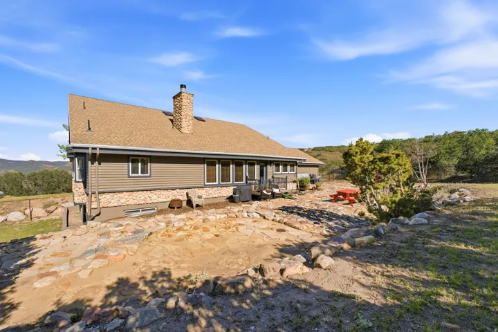 Stone-clad chimney and foundation accents