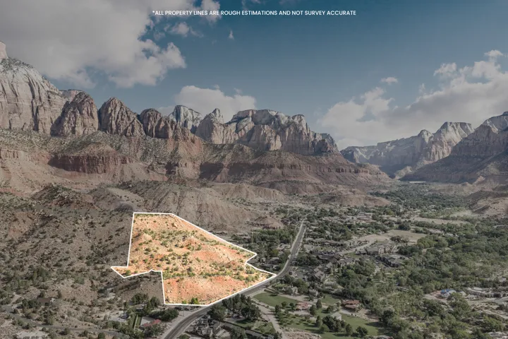 Expansive undeveloped parcel with natural desert landscaping and road frontage
