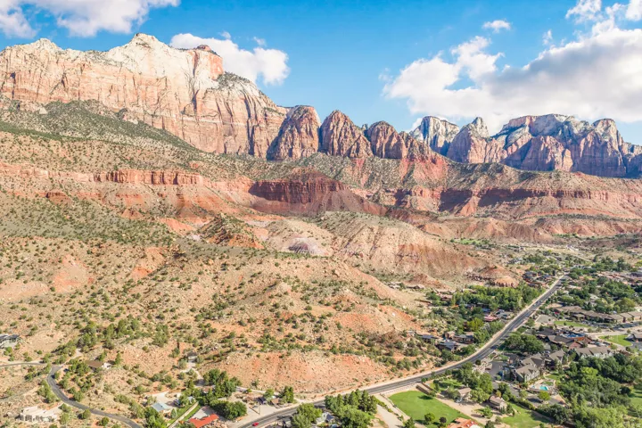 Expansive desert landscape with towering rock formations and natural terrain