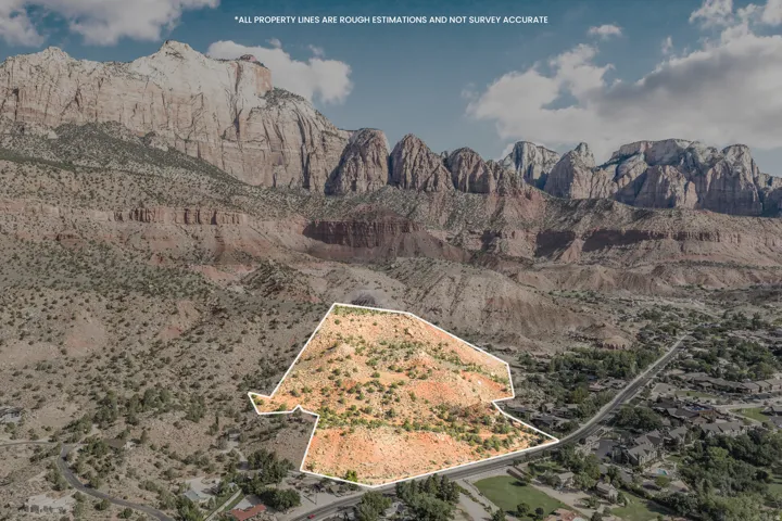 Expansive lot with natural desert landscaping, featuring a paved road frontage and proximity to mountainous terrain