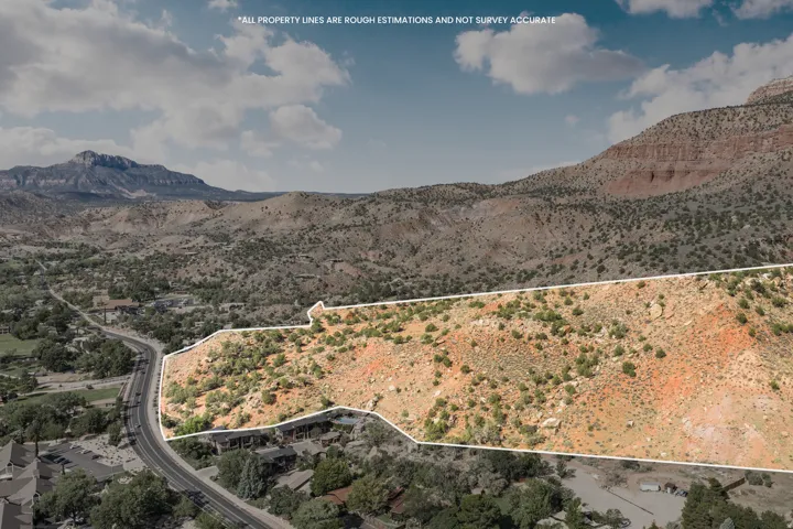 Expansive land parcel featuring natural desert flora, a gently sloping terrain, and a prominent mountainous backdrop