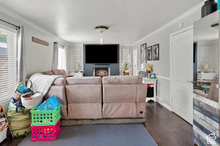 Dark wood-finish flooring complements light wall tones