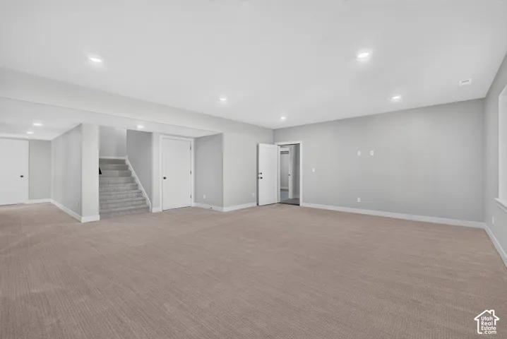 Door that you can see to the right is to the ADU - both ADU and Basment have their own separate entrances. There is a big patio under the deck outside the door of the main basement family room.