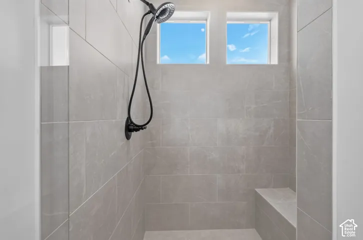shower with bench in primary suite