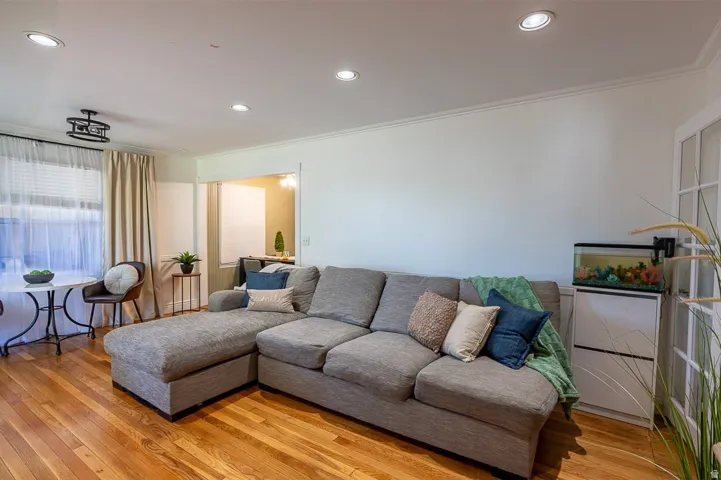 Spacious living room offers a welcoming space upon entering.