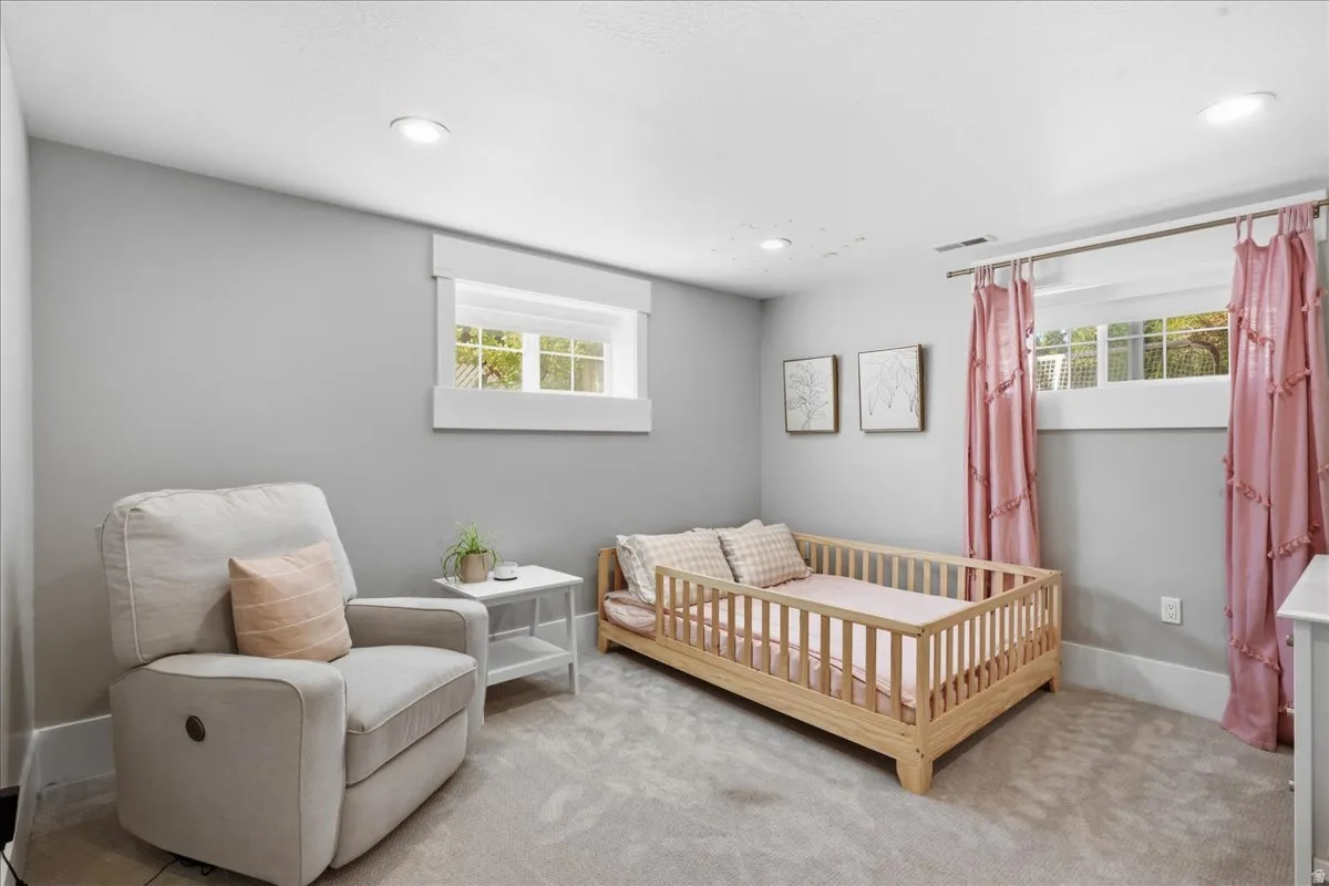 Recessed lighting, light gray wall finish, white trim, and carpeted flooring throughout