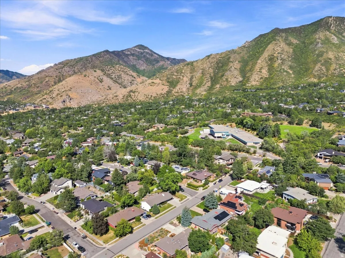 Expansive residential neighborhood featuring mature trees and mountain backdrops