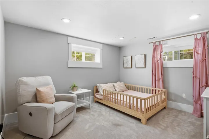 Recessed lighting, light gray wall finish, white trim, and carpeted flooring throughout