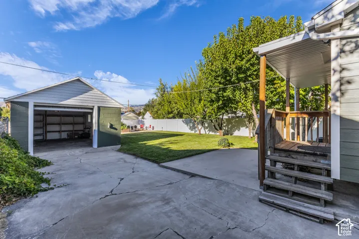 Detached garage, with opener. Porch and patio. Parking both in front of the gate and behind.