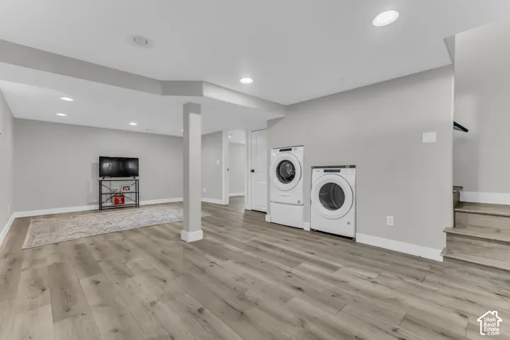 A cleverly designed laundry area is tucked neatly beneath the stairs, maximizing living space while keeping everyday chores convenient.