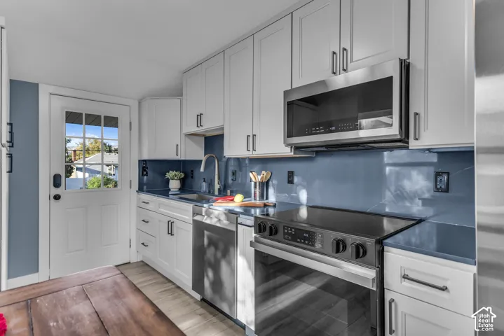 Imagine preparing meals with fresh produce picked from your own garden in this bright, efficient, beautifully updated kitchen. Sleek Samsung appliances are included, and abundant cabinetry provides plenty of storage for everything from everyday essentials