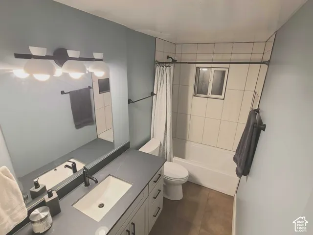 Clean, contemporary bathroom with an updated vanity, tile tub/shower, and timeless finishes.