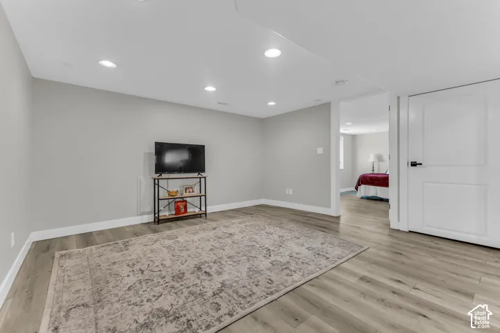 Whether it's family movie night or cheering on your favorite team, this bright lower-level living space offers plenty of room to gather and relax.