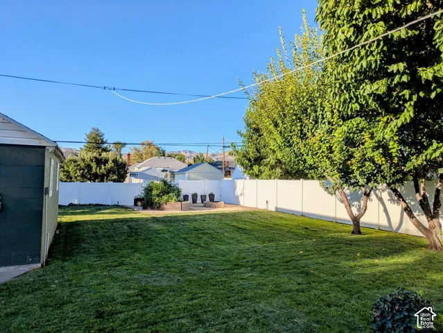 Gather around the fire pit, enjoy the expansive lawn, Tinker in the detached garage, or relax beneath the mature shade trees. There's plenty of room to work, play, entertain, or simply unwind, while automatic sprinklers keep the yard looking beautiful.