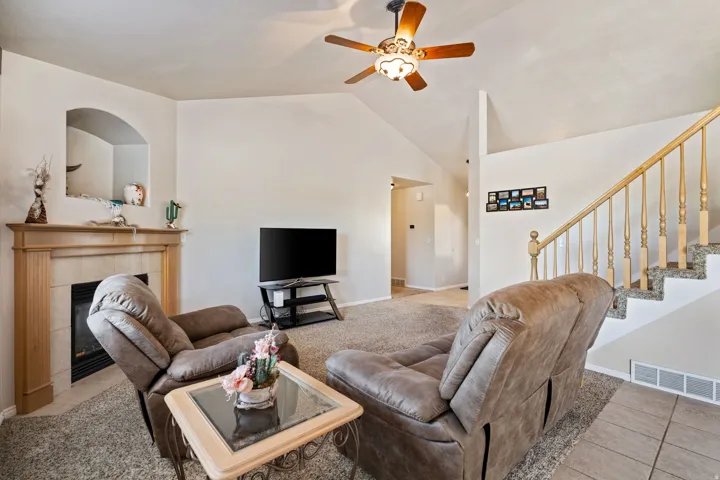 Open Concept. Vaulted Ceilings. Carpet. Tile. Large windows. Gas Fireplace.