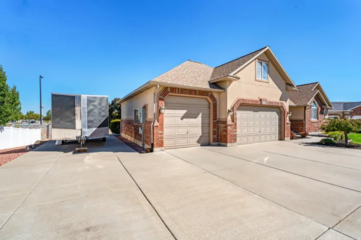 South Facing Rambler. Massive Driveway. RV Parking. 3 Car Garage (with larger overhead door and tandem deep 3rd car). Great curb appeal.