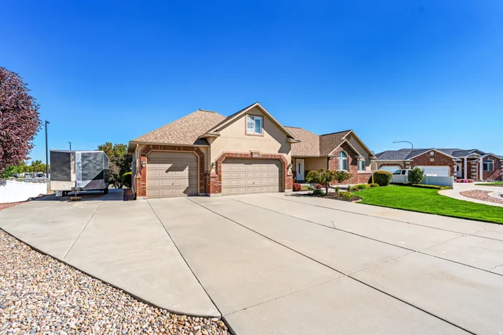 South Facing Rambler. Massive Driveway. RV Parking. 3 Car Garage (with larger overhead door and tandem deep 3rd car). Great curb appeal.