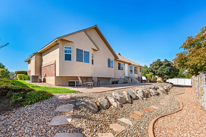 Backyard: Large patio. Room for your gazebo, your hot tub, and your outdoor furniture. Low maintenance. 90% zero scaped.