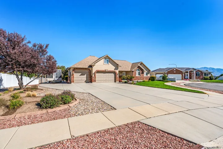 South Facing Rambler. Massive Driveway. RV Parking. 3 Car Garage (with larger overhead door and tandem deep 3rd car). Great curb appeal.