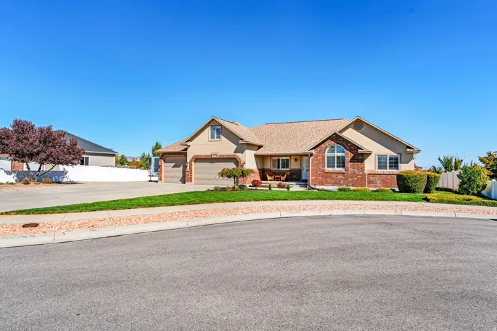 South Facing Rambler. Massive Driveway. RV Parking. 3 Car Garage (with larger overhead door and tandem deep 3rd car). Great curb appeal.