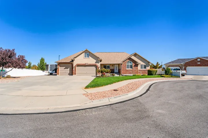 South Facing Rambler. Massive Driveway. RV Parking. 3 Car Garage (with larger overhead door and tandem deep 3rd car). Great curb appeal.