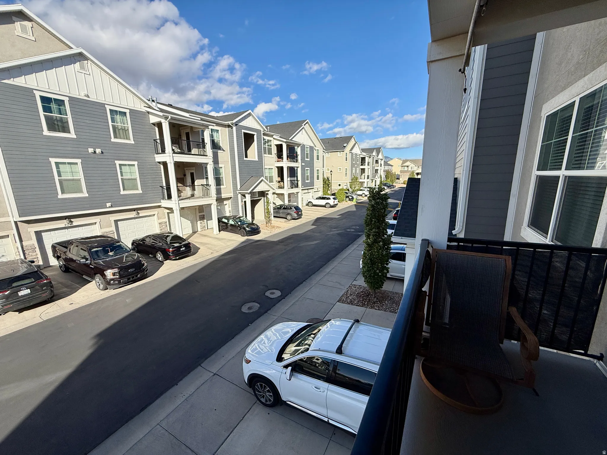 Balcony with black metal railing