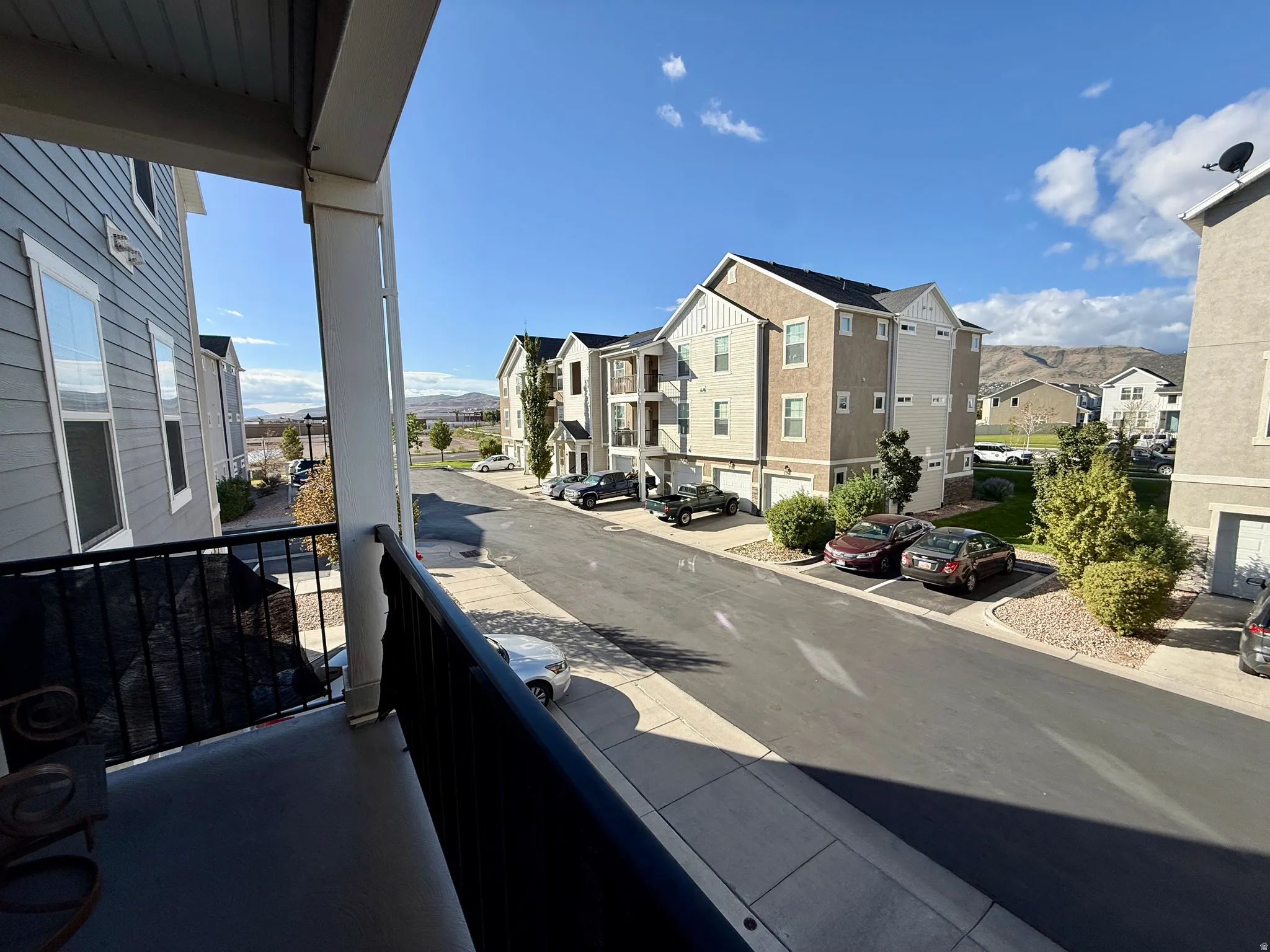 Exterior balcony with black metal railing