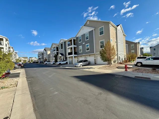 Multi-story residential buildings with attached garages and private balconies