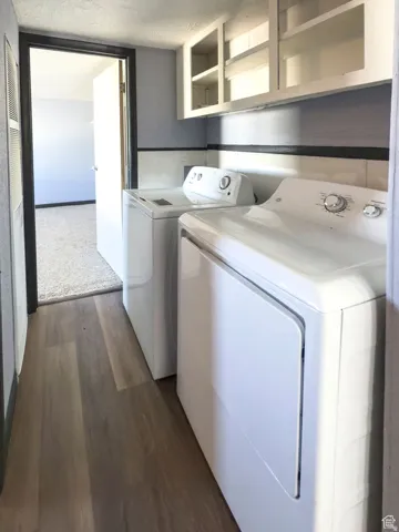 Wood-finish flooring with overhead cabinetry