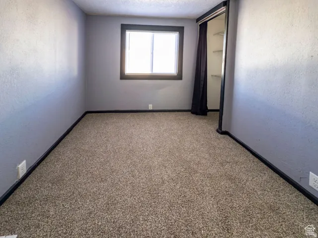 Wall-to-wall carpeting with painted walls and trim