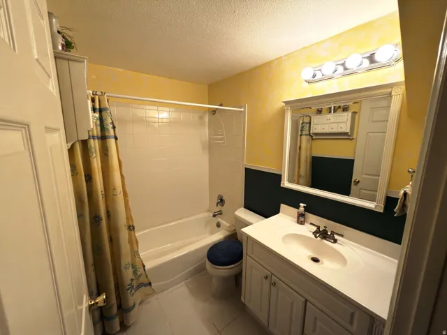 White subway tile shower surround with a built-in tub