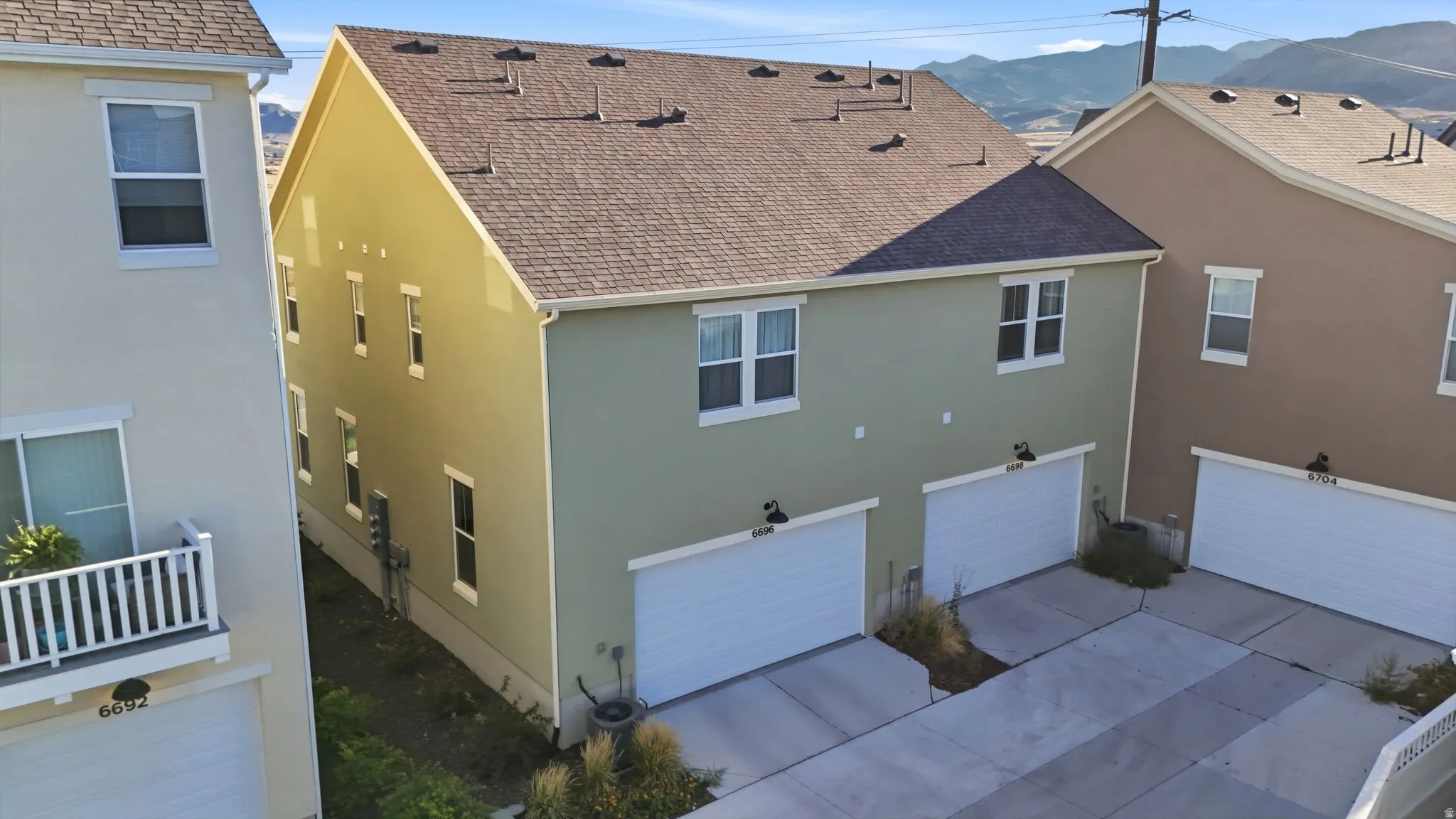 Dual garage doors with exterior sconce lighting