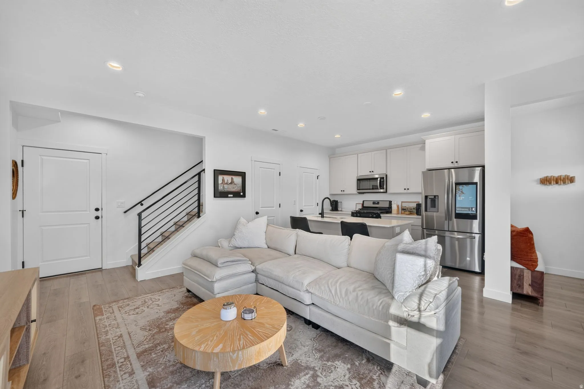 Recessed lighting illuminating wood-finish flooring
