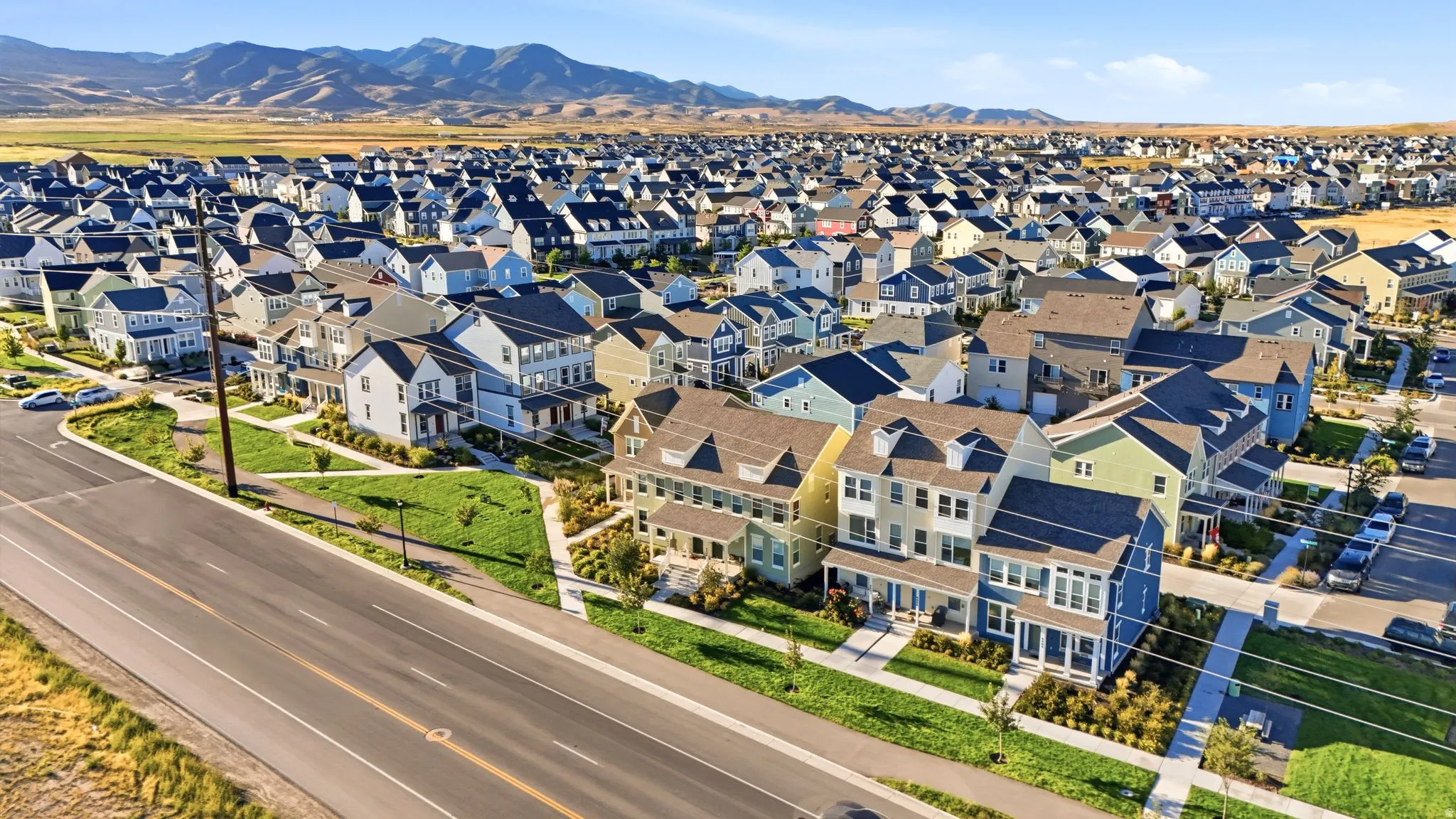Expansive residential development featuring varied architectural styles and mountain scenery