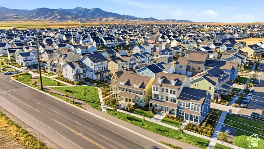 Expansive residential development featuring varied architectural styles and mountain scenery