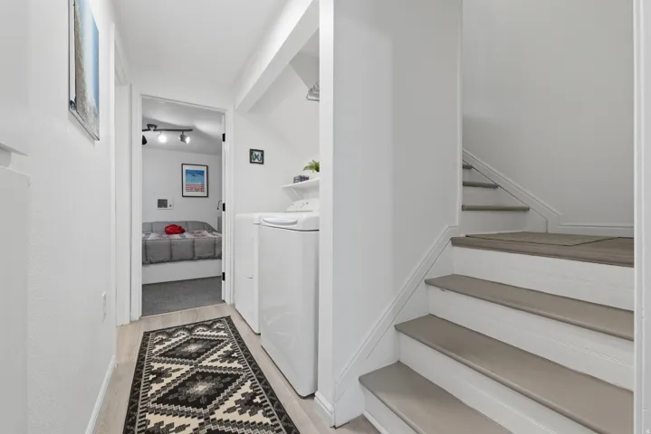 Integrated laundry area with top-load washing machine and front-load dryer